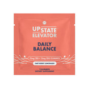 Upstate Elevator Daily Balance two-gummy sample sachet in coral, 15mg CBD and 15mg CBG per gummy, tart berry lemonade flavor